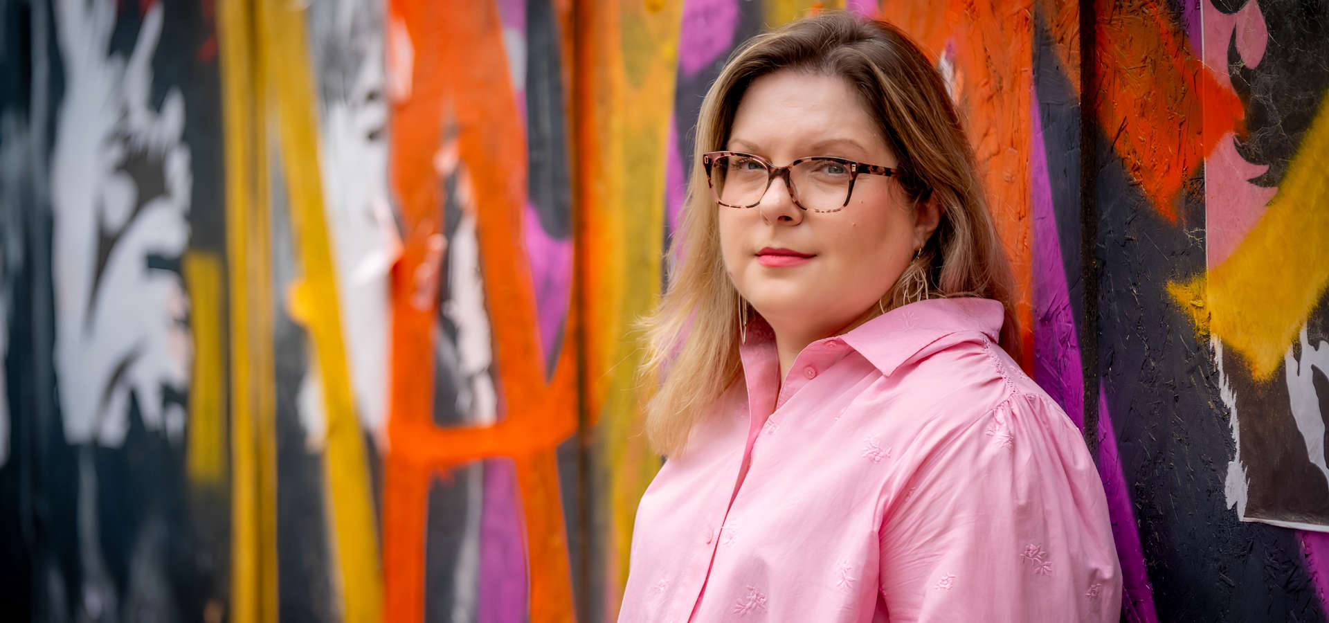 Jayne against graffiti wall